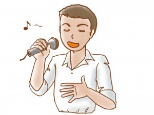 カラオケで歌いやすい曲を歌う男性